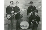 Four guys with guitars and drums