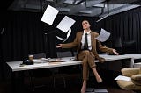 Lightfield Studios Businesswoman sitting on table under falling paper blanks, crossing legs, looking at camera — corporate, desk — Stock Photo | #271637202