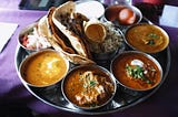 Why do Indians prefer to eat Indian food when abroad?