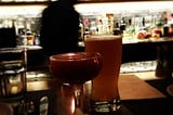 Glasses of beer and booze on a bar