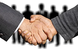 business-handshake-how-to-reduce-risk-working-with-new-ousourcing-team