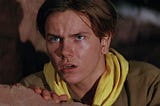 A young Indiana Jones (River Phoenix) stares