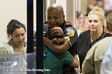 This is a picture of a Dallas Police Officer mourning his colleagues who were murdered by snipers.