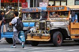 Photo: Traditional jeepneys stop at a pedestrian crossing (https://www.pna.gov.ph/photos/70310)