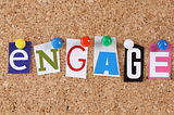Letters pinned on a board spelling “engage”