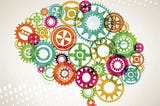 Illustration of a brain shape made from colorful interlocking gears.