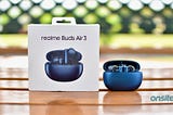 realme Buds Air 3 in starry blue colour displayed alongside its box.