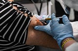 A participant in a Covid-19 vaccine trial receives a dose of the vaccination in Hollywood, Florida…