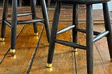 Furniture Hack for Adding Brass Leg Tips
