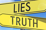 An image of two signs pointing in opposite directions, one with the word “lies” and one with the word “truth”