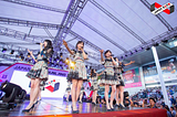 A jpop idol group performing on stage. Idol groups are an important part of the Japanese music industry.