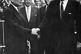 U Thant, Adlai Stevenson, and President Kennedy outside UN Headquarters in New York.