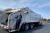 Nick Stroboulis on a garbage truck