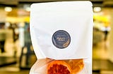 A pouch of Philomena's Boutique's dried blood orange garnish, perfect for adding a burst of flavor to your gin and cocktail drinks