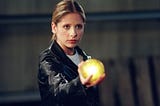 Buffy holds a glowing yellow ball