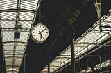 Station clock showing ten past five.