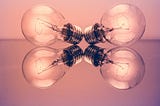 Lightbulbs on pink backdrop