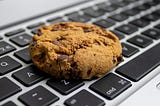 A choco-chip cookie on a laptop’s keypad