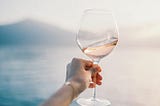 woman hand holding a wine glass