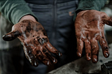 An image of greasy hands