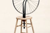 And then someone took a bicycle wheel and mounted it upside down on a stool…why isn’t your CEO or…