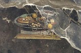 This is depiction of what is may be the first known pizza on wall of an ancient Pompeian house