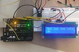 An Arduino board with an LCD screen I designed to read “Get out the vote.”