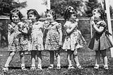 The Heartbreaking Childhood of the World’s Most Famous Quintuplets