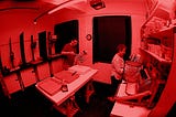 In the red: safe light conditions in the darkroom.
