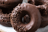 The Holy Trinity of Donuts: Exploring the Symbolism Behind Circular Shapes