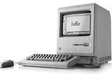 Original Macintosh computer with “Hello” written on screen