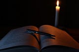candle and book of spells