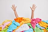 pile of clothes — https://t3.ftcdn.net/jpg/04/40/53/90/360_F_440539033_2a76yiN1cB1pEOT2njwYkVgIrLCO0of3.jpg
