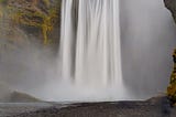 The Skogafoss Waterfall in Iceland on a rainy summer day.