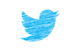 alt=”logo of social media site twitter drawn with a blue crayon”