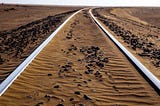 Train tracks in desert.