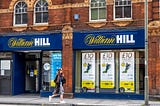 888 share price dips 2.5% after surprise £2 billion capture of William Hill European Business