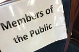 A sign at the council chamber, anointing this chair as the designated seating area for Members Of The Public