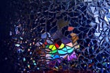 Picture of broken glass with lines and colours Image credit — pexels, alexander-grey