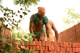 Bricklayer in India. Source: https://www.maxpixel.net/Loading-Bricks-Indian-Labour-Truck-Labourer-166919