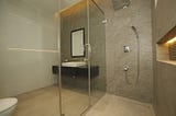 Enhancing Bathroom Aesthetics and Functionality with Glass Shower and Urinal Partitions