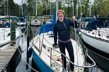 Photo of author standing on his sailboat