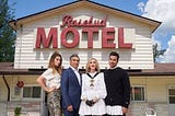 The Rose family (Alexis, Johnny, Moira, David) pose in front of their new home in Schitt’s Creek, the Rosebud Motel.