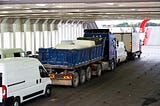 A truck along with other vehicles in a traffic.