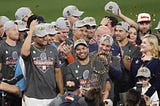 Jose Altuve of the Houston Astros holds the Commisioner’s Trophy following the Astros’ 2022 World Series win.