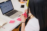 woman using sticky notes to plan out her future state