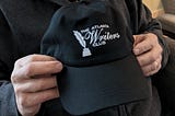 Atlanta Writers Club hat in Dave’s hands.