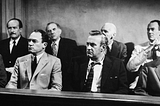 The jurors from 12 Angry Men completing their jury duty