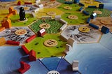 Settlers of Catan game board showing resources with numbers associated with each tile