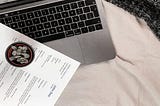 resume laying on top of a mac laptop